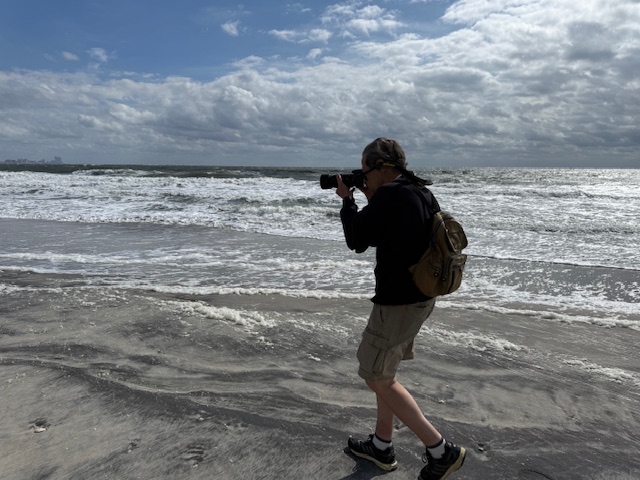 Alan Kotok with camera at beach, Sept 2025