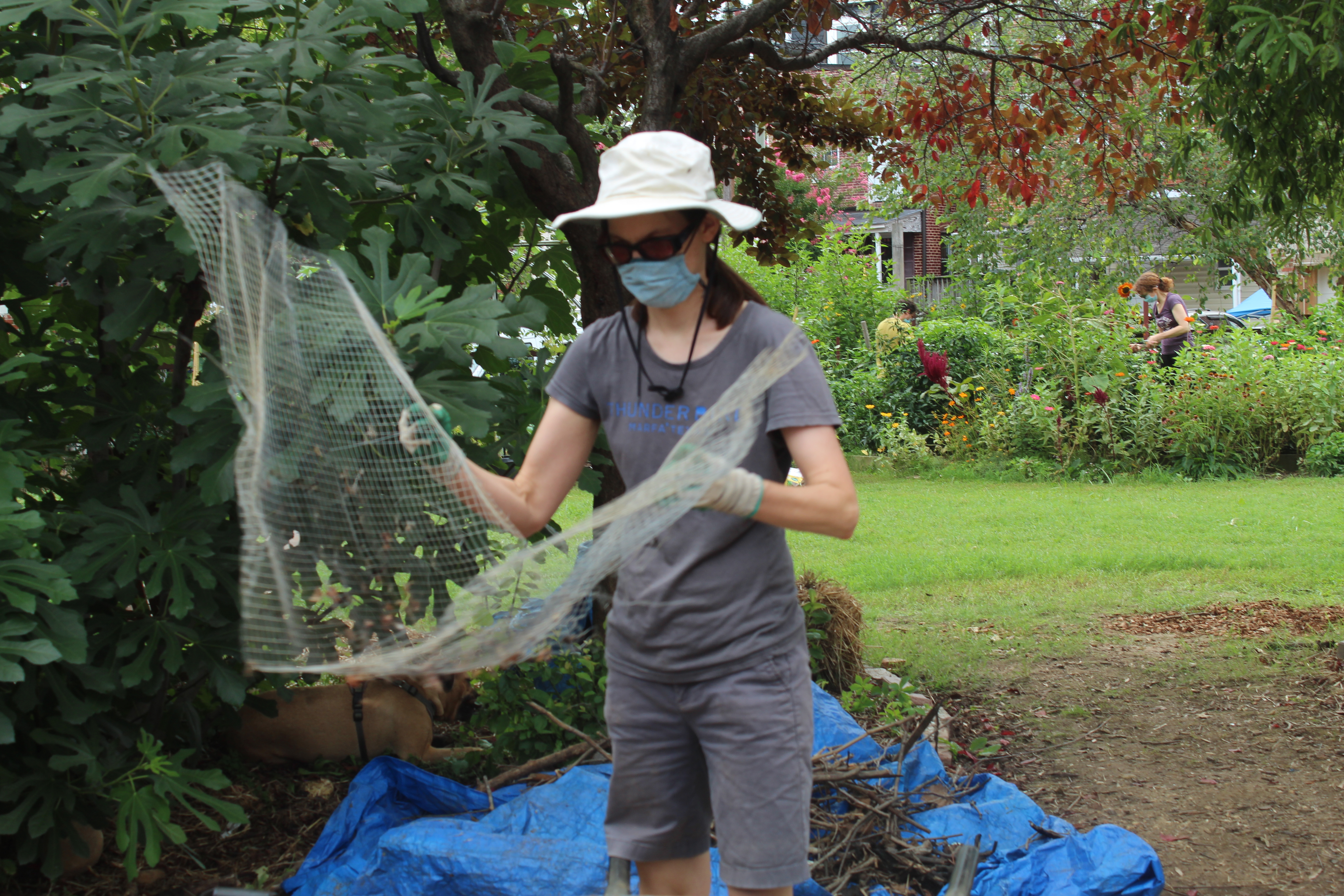 Worker by a compost device